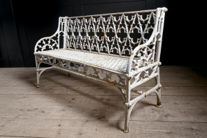 cast iron English garden bench Gothic. Painted white aged patina.Braced legs Mid century English