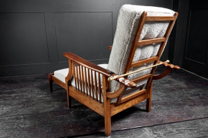 Extending English arts and crafts metamorphic salon smokers chair William Morris Liberty's of London lounger Oak and Mahogany marquetry contemporary Boucle upholstery Early 20th Century. Circa 1920