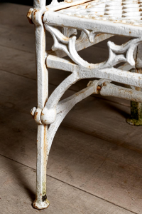 cast iron English garden bench Gothic. Painted white aged patina.Braced legs Mid century English