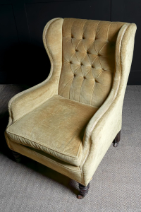 mustard yellow coloured Victorian winged arm chair buttoned back Turned mahogany front legs sabred back legs ceramic brass castors Stamped Cornelius V. Smith English circa 1880