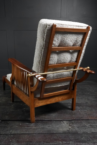 Extending English arts and crafts metamorphic salon smokers chair William Morris Liberty's of London lounger Oak and Mahogany marquetry contemporary Boucle upholstery Early 20th Century. Circa 1920