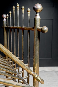 Gothic styled German brass shoe rack  finials globed ends  oxidised patina ageing  circa 1920